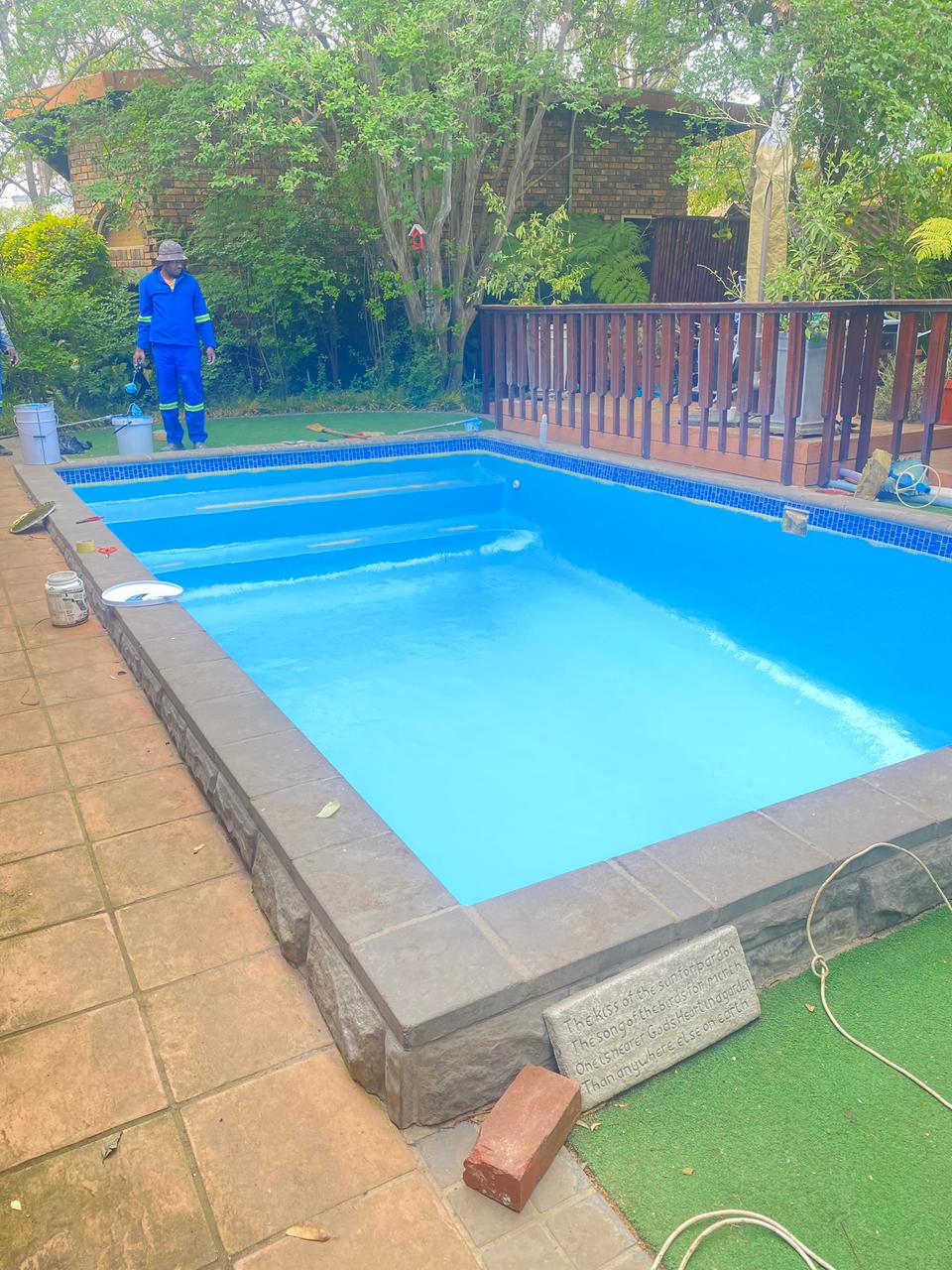 Our team at work by the pool